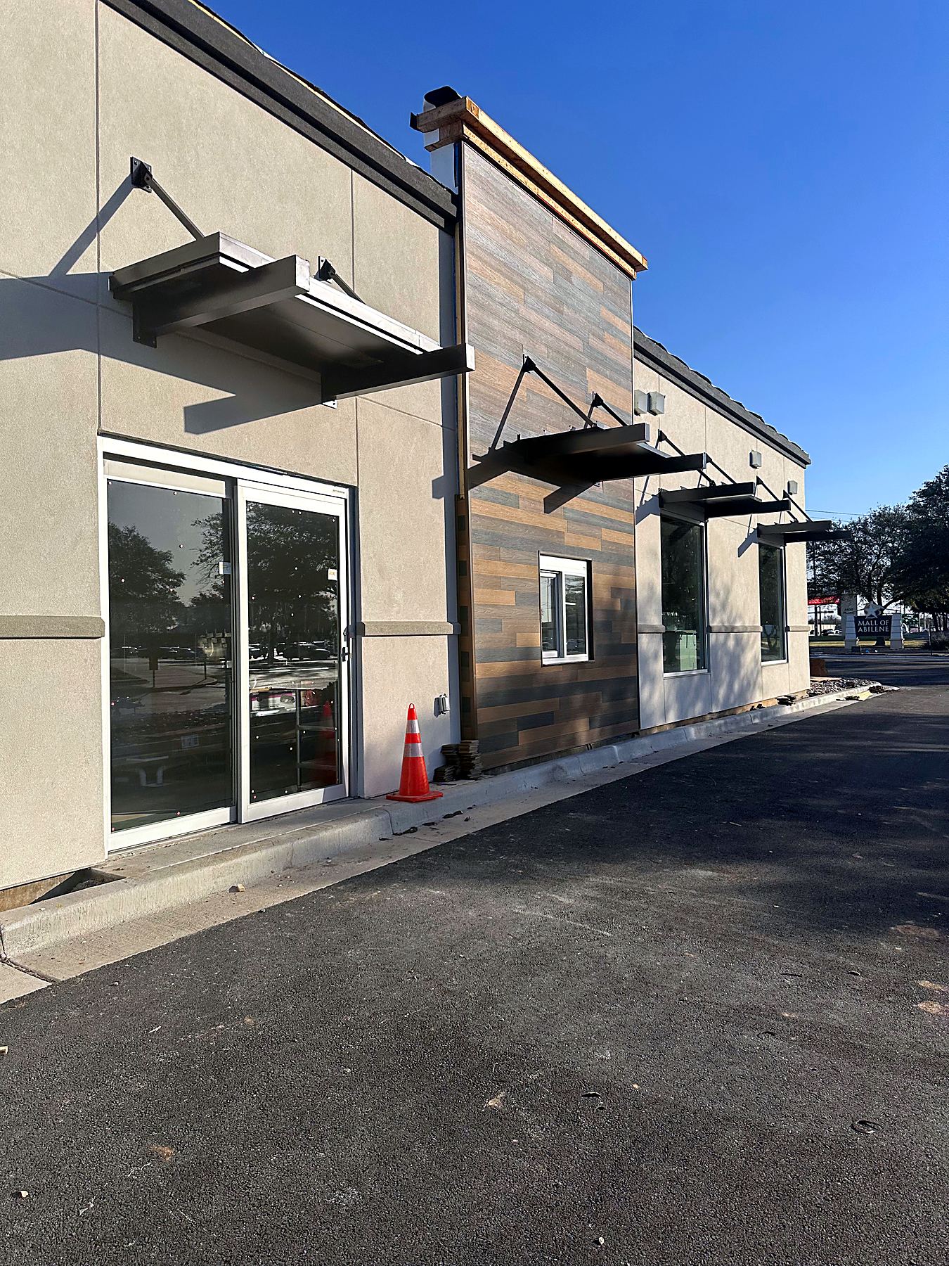 HTeaO storefront with wood-look siding
