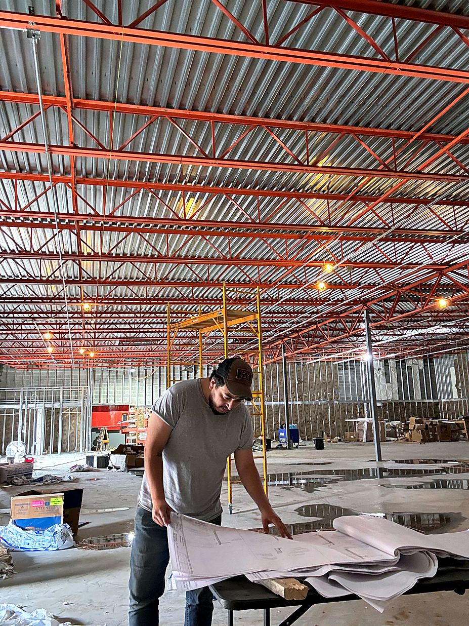 Foreman reviewing plans on site