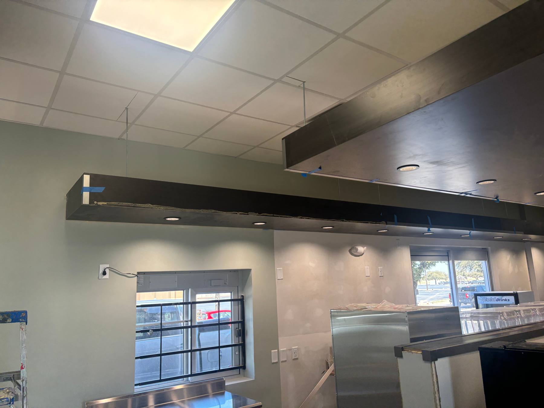 Dryfall paint on exposed roof structure